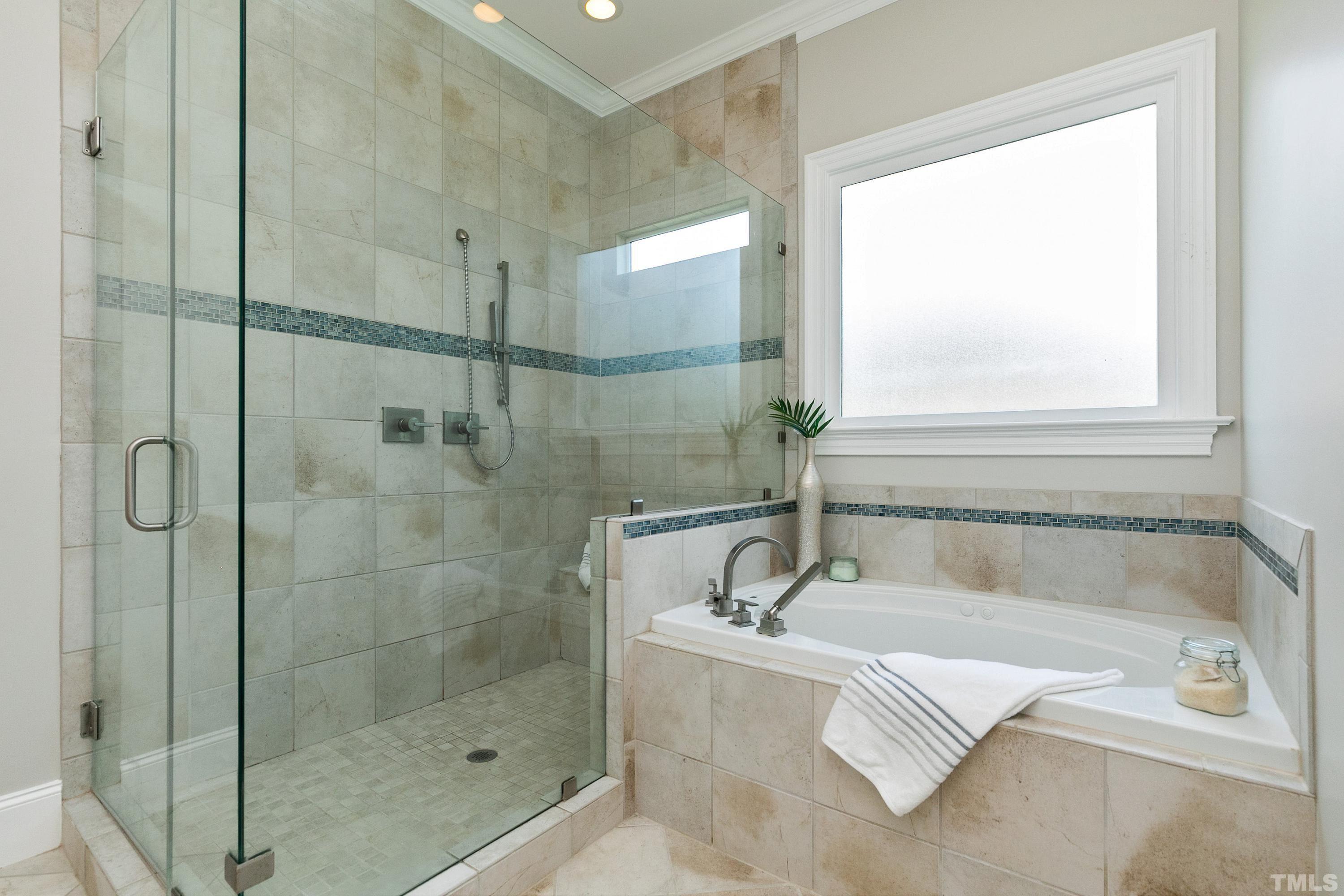 302 Michelangelo Way Cary, NC 27518 - Photo 24 of 44 a bath tub sitting next to a shower