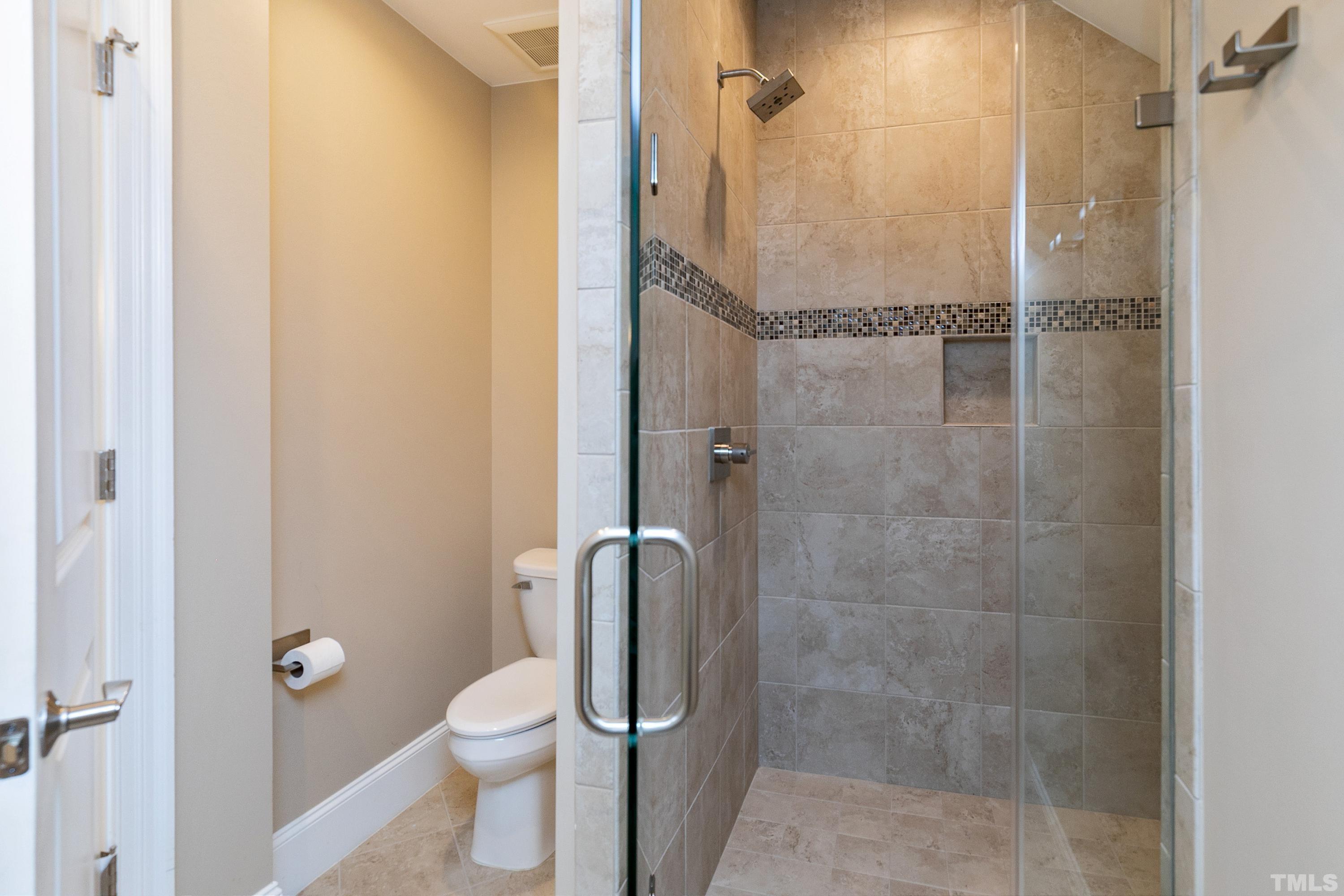 302 Michelangelo Way Cary, NC 27518 - Photo 30 of 44 a bathroom with a toilet and shower