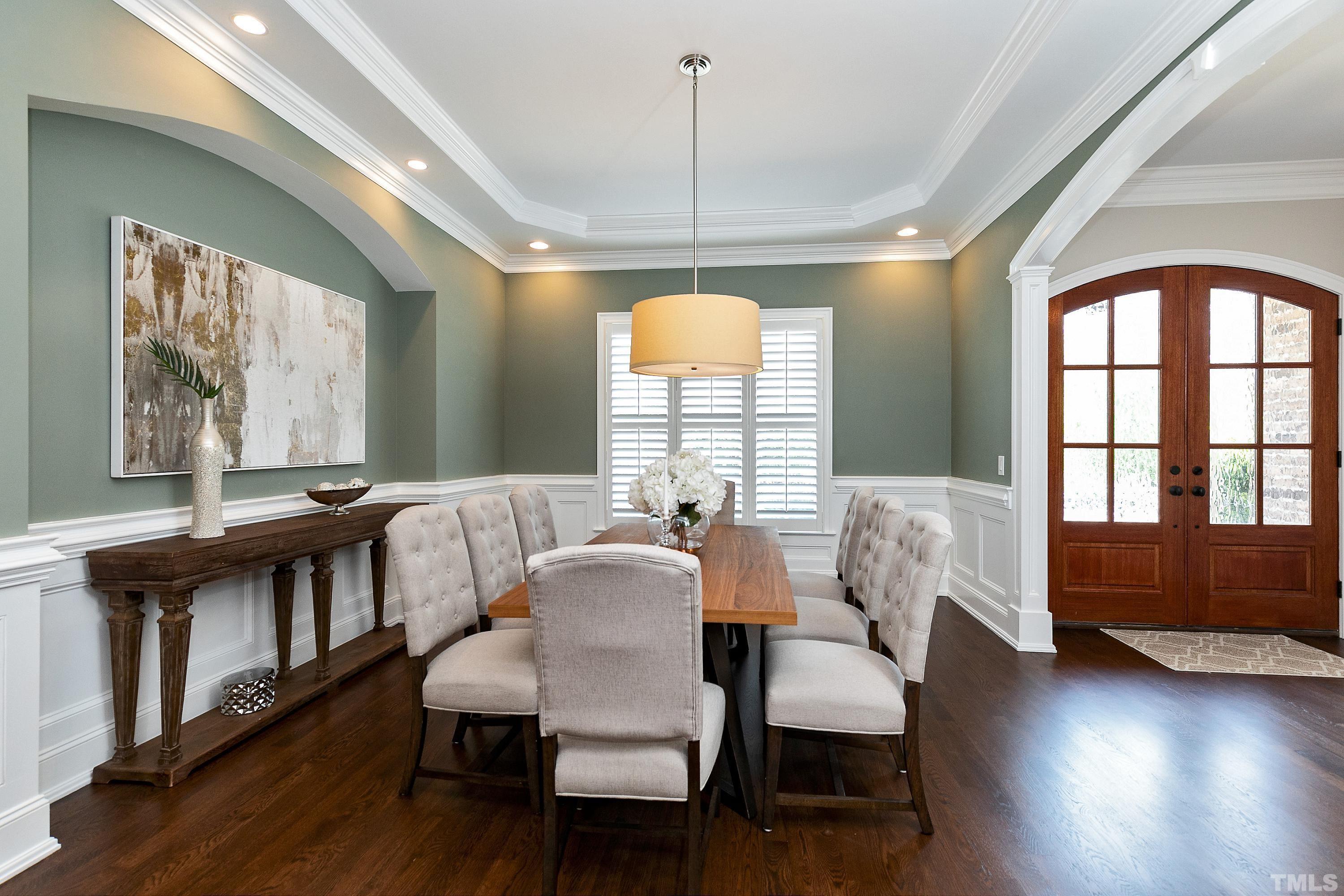 302 Michelangelo Way Cary, NC 27518 - Photo 3 of 44 a view of a dining room with furniture window and wooden floor