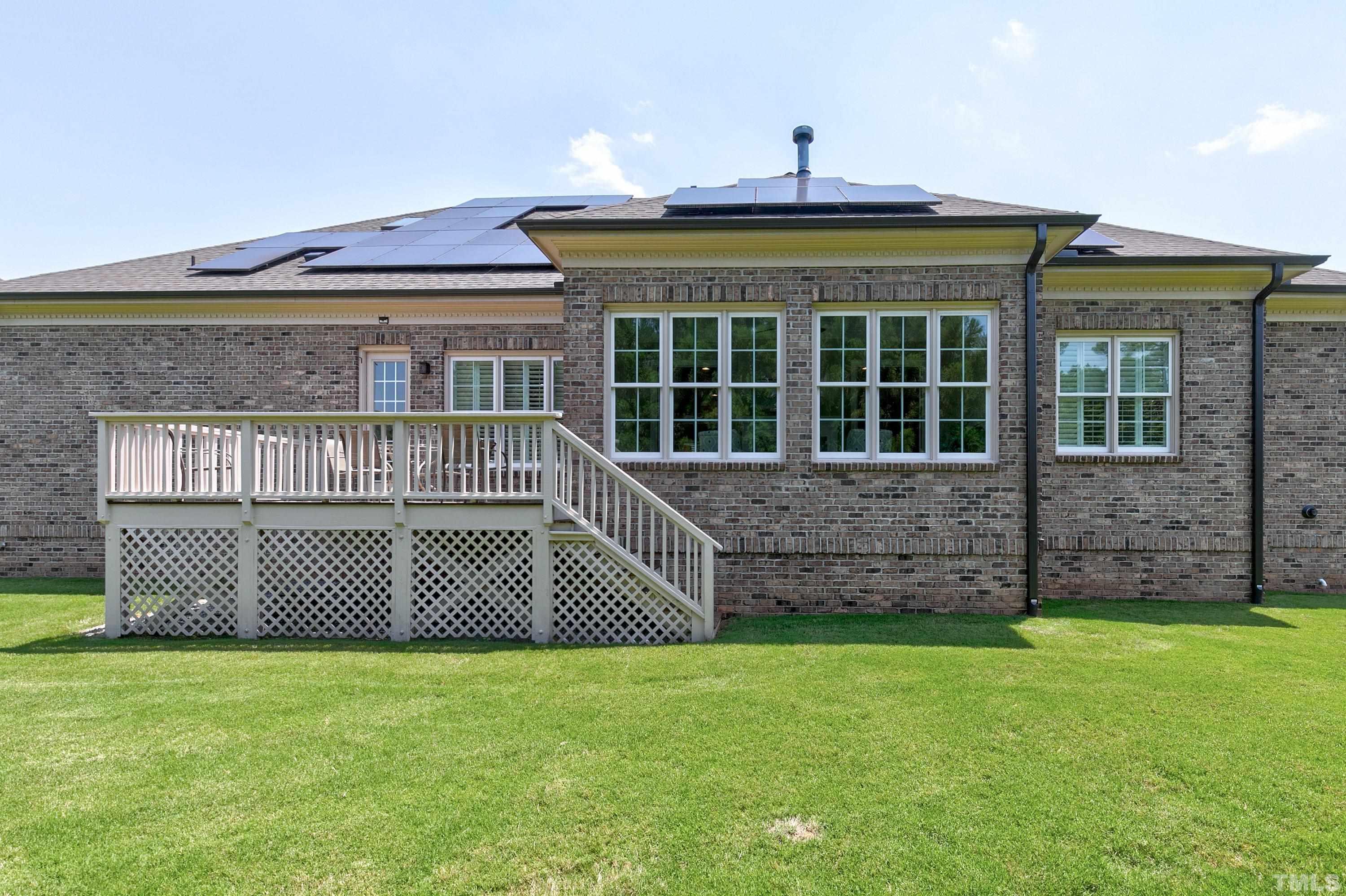 302 Michelangelo Way Cary, NC 27518 - Photo 37 of 44 a front view of a house with a garden