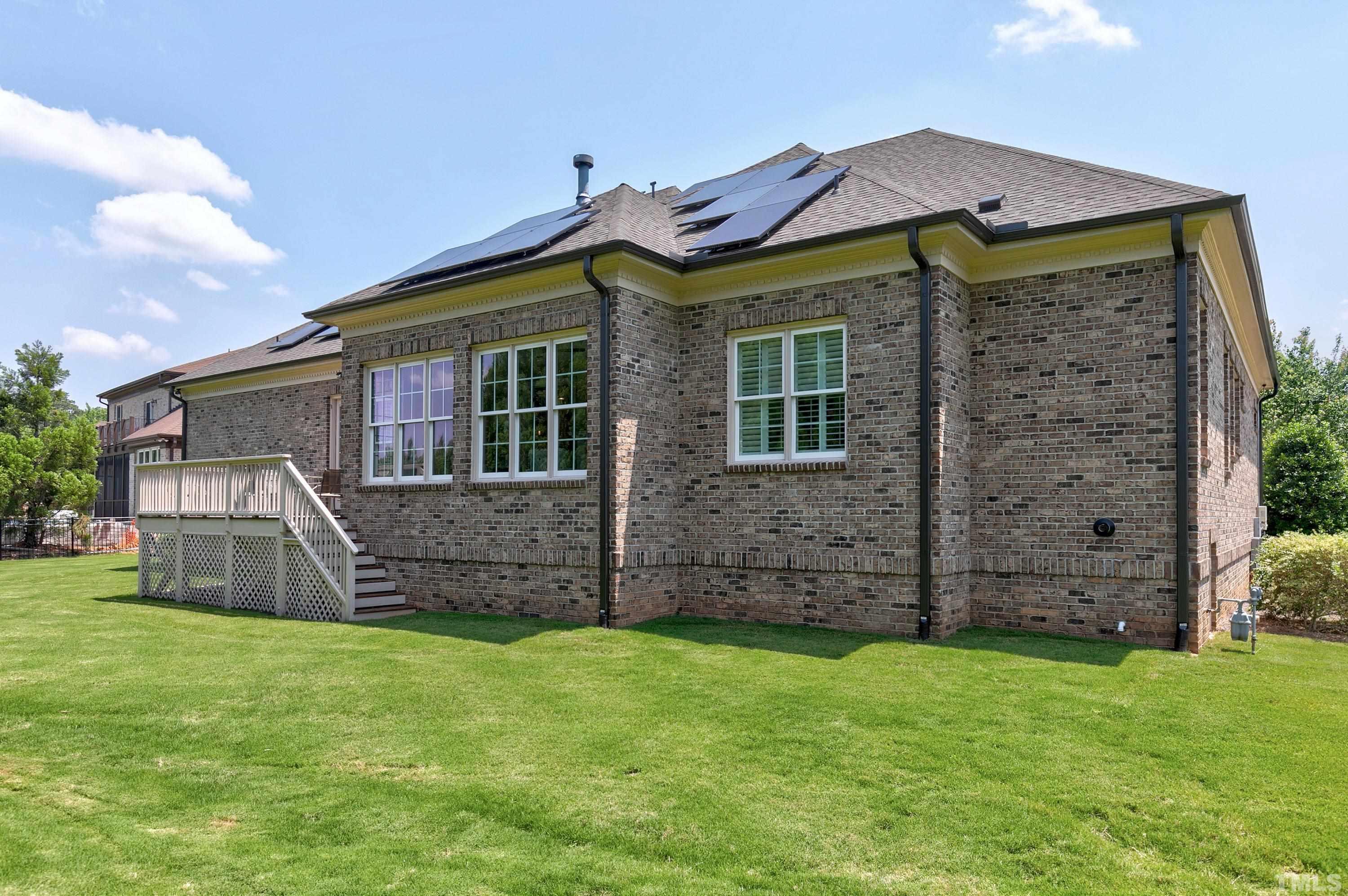 302 Michelangelo Way Cary, NC 27518 - Photo 38 of 44 a front view of a house with a garden