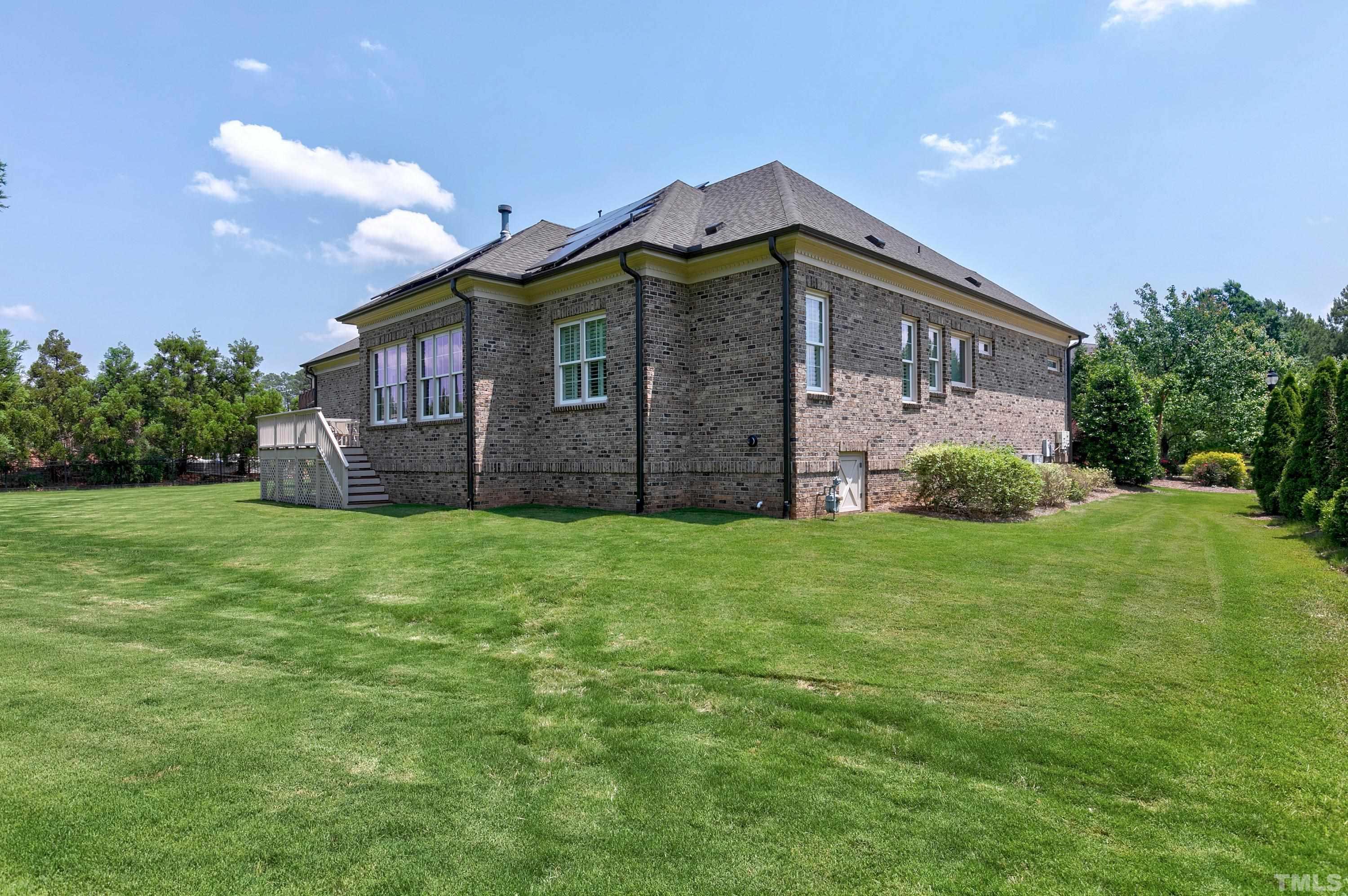 302 Michelangelo Way Cary, NC 27518 - Photo 39 of 44 a view of a house with a backyard