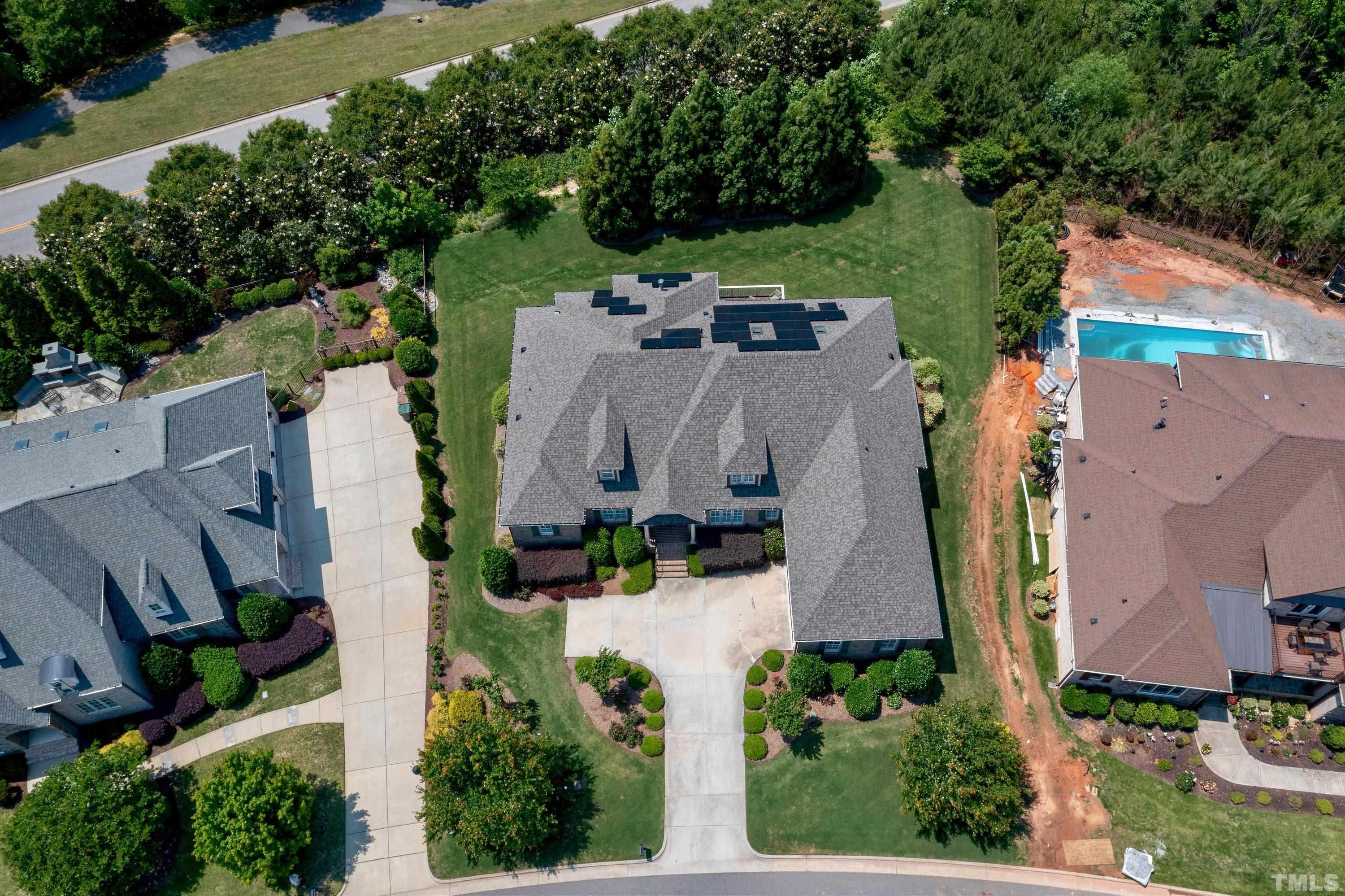302 Michelangelo Way Cary, NC 27518 - Photo 40 of 44 an aerial view of a house with yard and outdoor seating