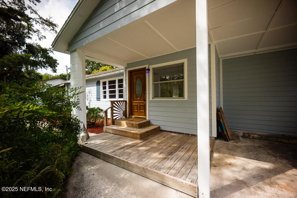 9965 Arnold Road Jacksonville, FL 32246 - Photo 11 of 60 a view of a house with backyard and porch