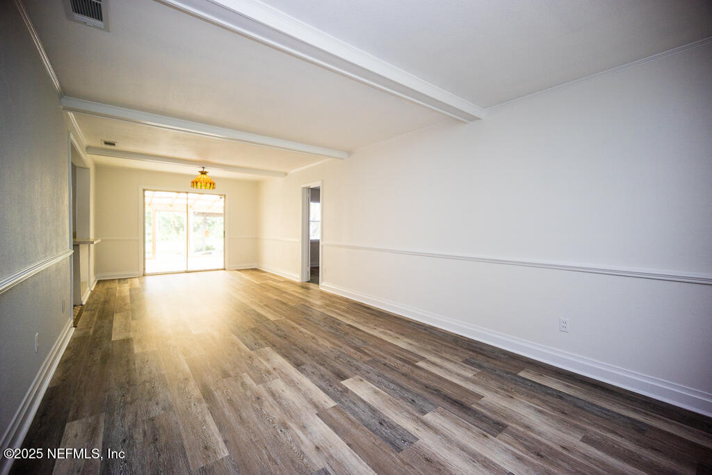 9965 Arnold Road Jacksonville, FL 32246 - Photo 15 of 60 a view of empty room with wooden floor