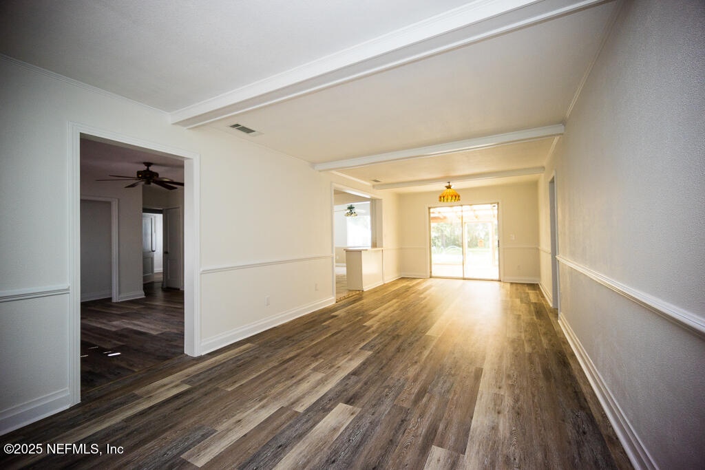 9965 Arnold Road Jacksonville, FL 32246 - Photo 16 of 60 a view of empty room with wooden floor and fan