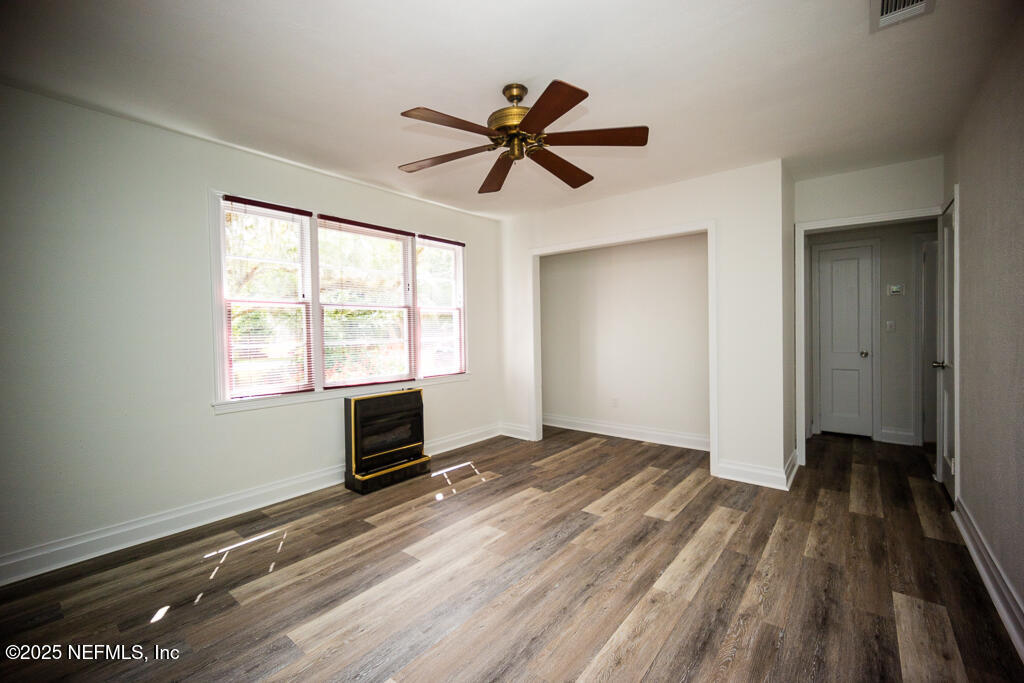 9965 Arnold Road Jacksonville, FL 32246 - Photo 20 of 60 wooden floor in an empty room with a window
