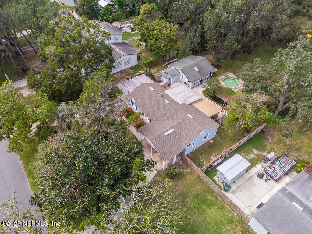 9965 Arnold Road Jacksonville, FL 32246 - Photo 3 of 60 an aerial view of a house with a garden