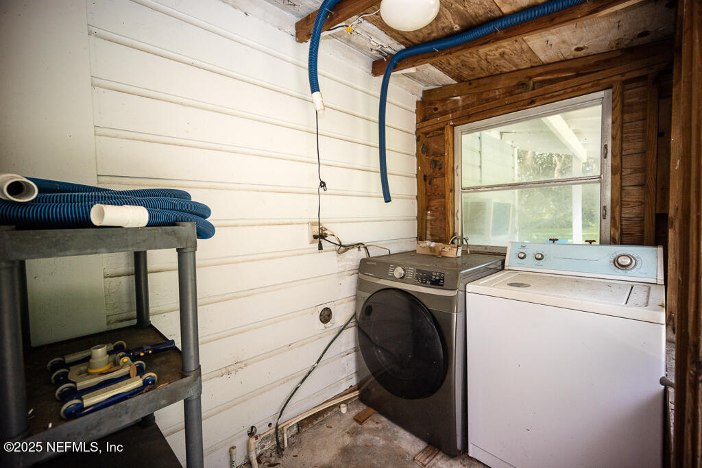 9965 Arnold Road Jacksonville, FL 32246 - Photo 37 of 60 a utility room with dryer and washer