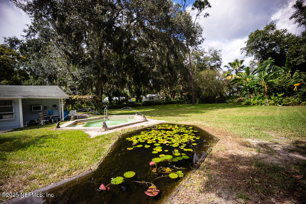 9965 Arnold Road Jacksonville, FL 32246 - Photo 45 of 60 a view of a swimming pool with lounge chair