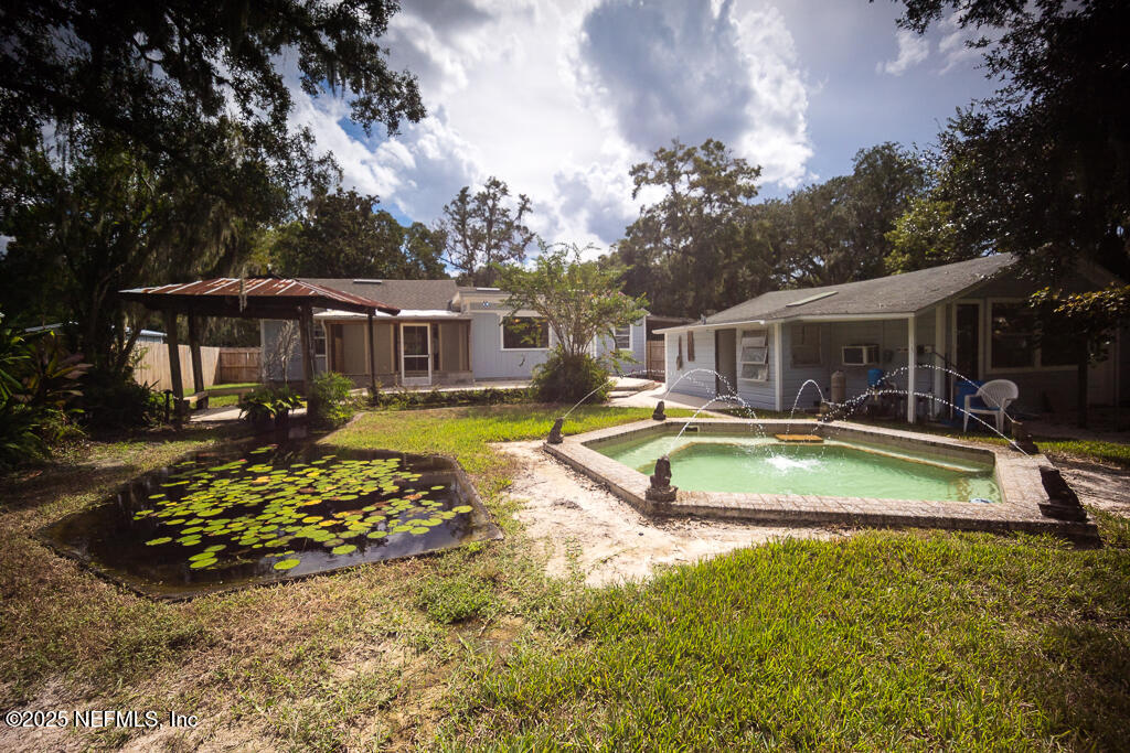 9965 Arnold Road Jacksonville, FL 32246 - Photo 46 of 60 an aerial view of a house with swimming pool and porch