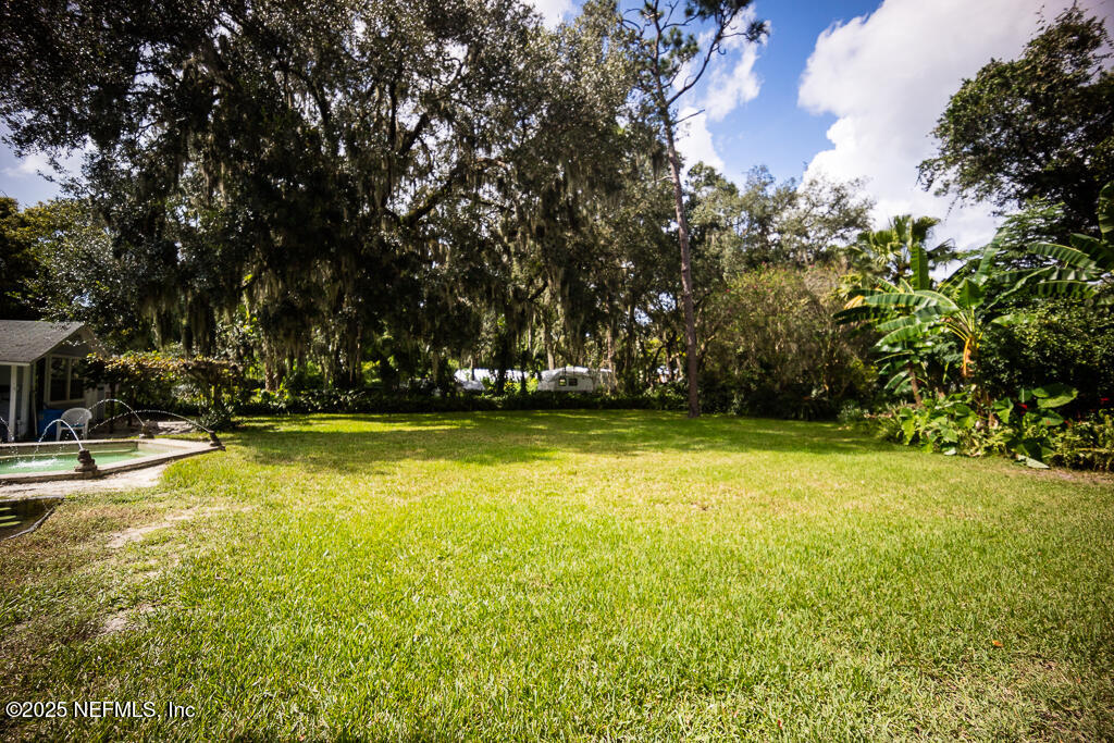 9965 Arnold Road Jacksonville, FL 32246 - Photo 48 of 60 a view of a swimming pool with an outdoor space
