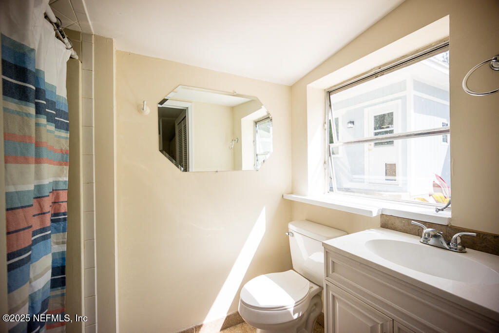 9965 Arnold Road Jacksonville, FL 32246 - Photo 53 of 60 a bathroom with a sink a toilet and shower