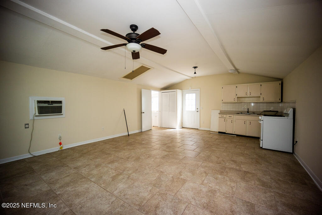 9965 Arnold Road Jacksonville, FL 32246 - Photo 56 of 60 a view of a kitchen with a sink dishwasher and wooden floor