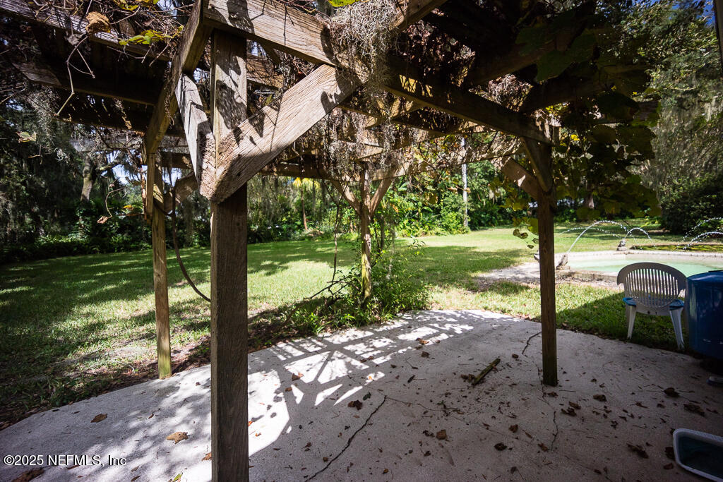 9965 Arnold Road Jacksonville, FL 32246 - Photo 57 of 60 a view of a yard with street from a tree