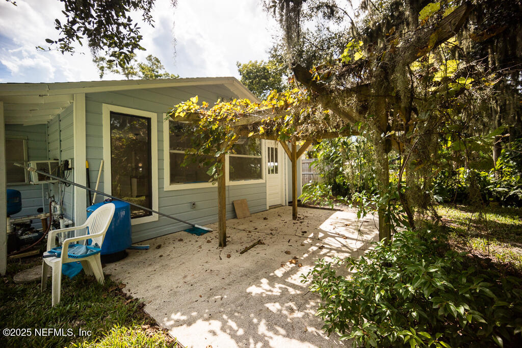 9965 Arnold Road Jacksonville, FL 32246 - Photo 58 of 60 a view of a chair and table in backyard of the house
