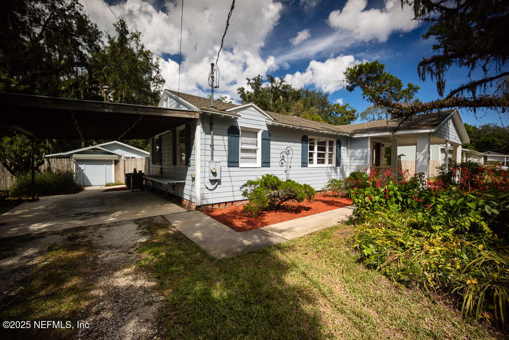 9965 Arnold Road Jacksonville, FL 32246 - Photo 6 of 60 a front view of a house with a yard
