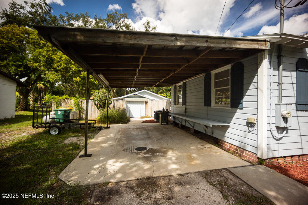 9965 Arnold Road Jacksonville, FL 32246 - Photo 7 of 60 a view of a backyard with sitting area