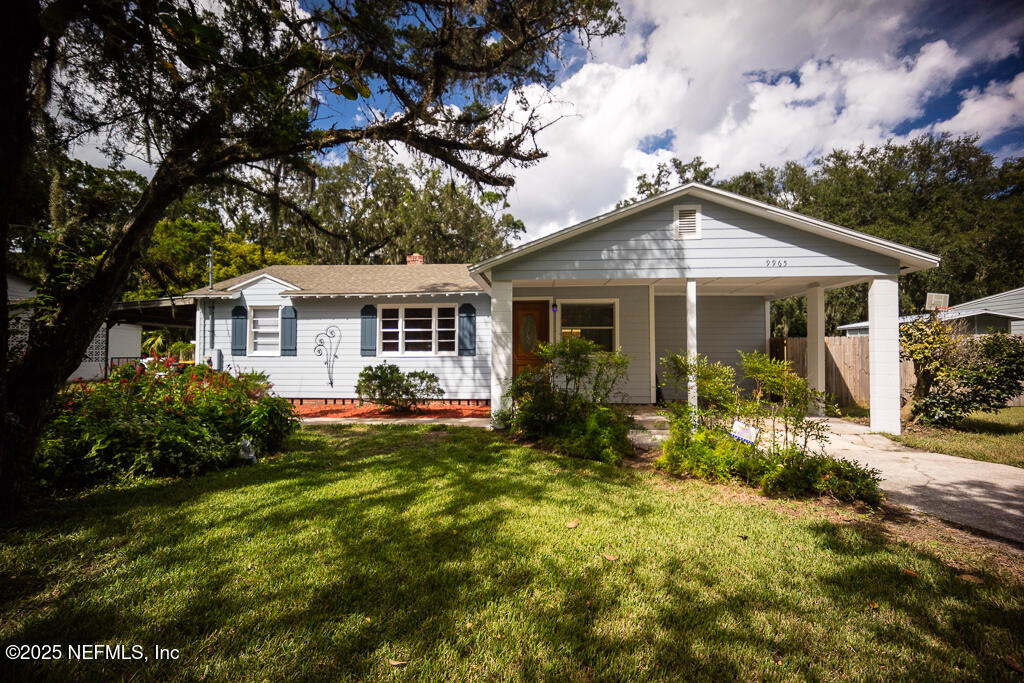 9965 Arnold Road Jacksonville, FL 32246 - Photo 8 of 60 a front view of a house with garden