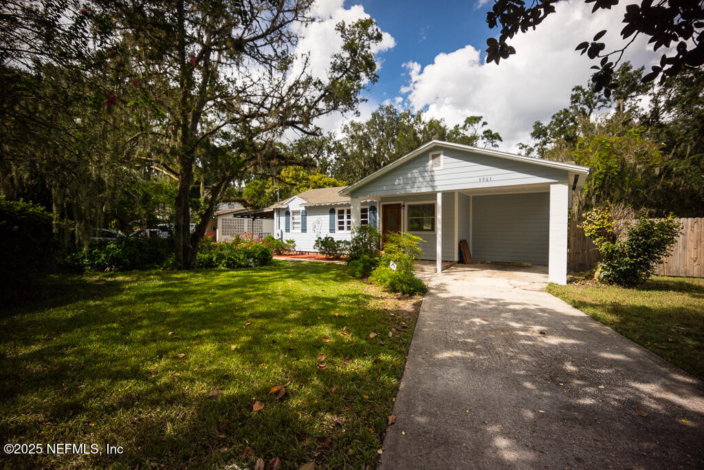 9965 Arnold Road Jacksonville, FL 32246 - Photo 9 of 60 a front view of a house with a yard