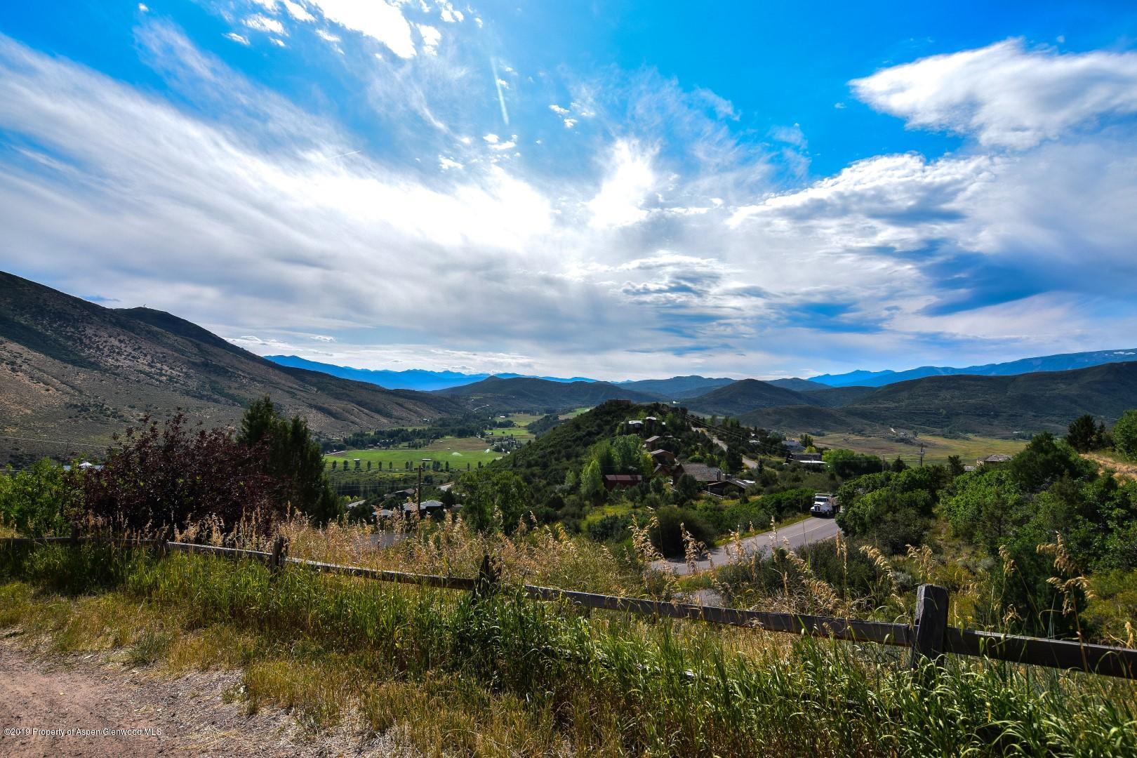 a view of a lake with a yard