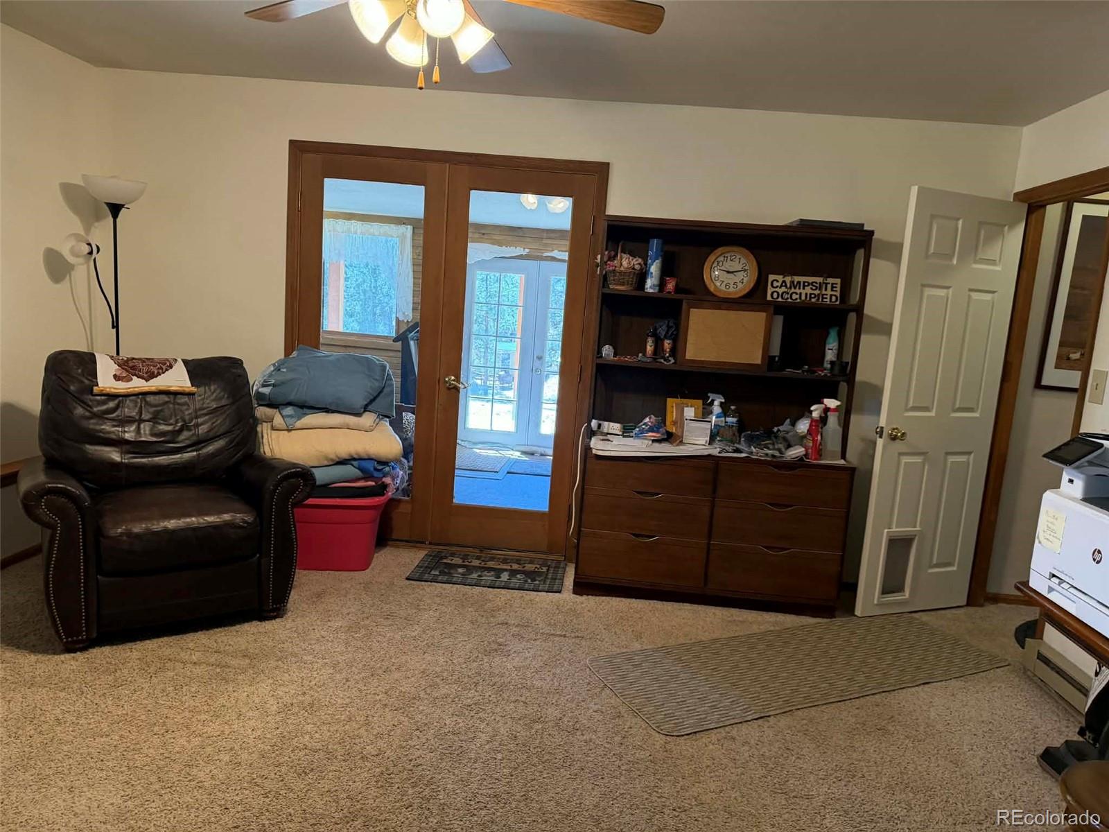 33623 Smith Road Pine, CO 80470 - Photo 15 of 45 a living room with furniture a window and a flat screen tv