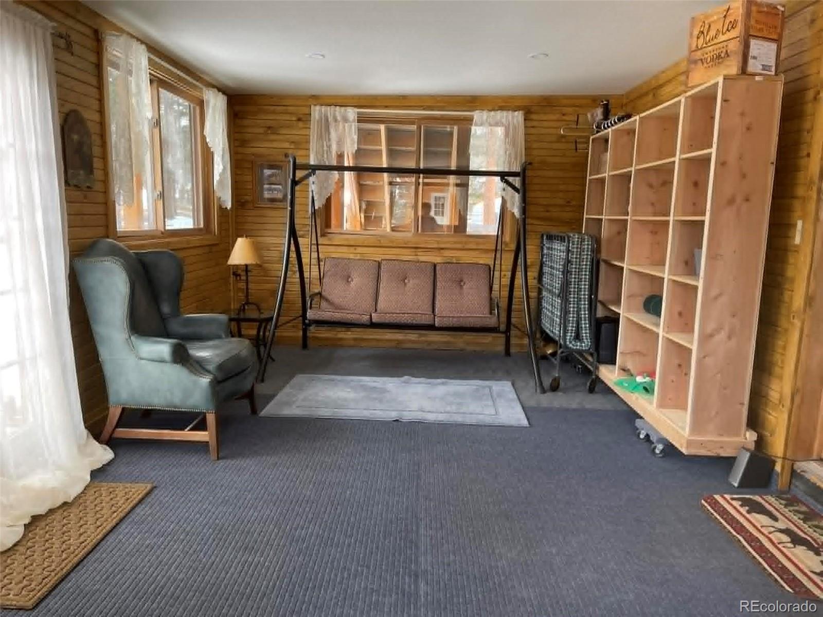 33623 Smith Road Pine, CO 80470 - Photo 19 of 45 a living room with furniture and a window