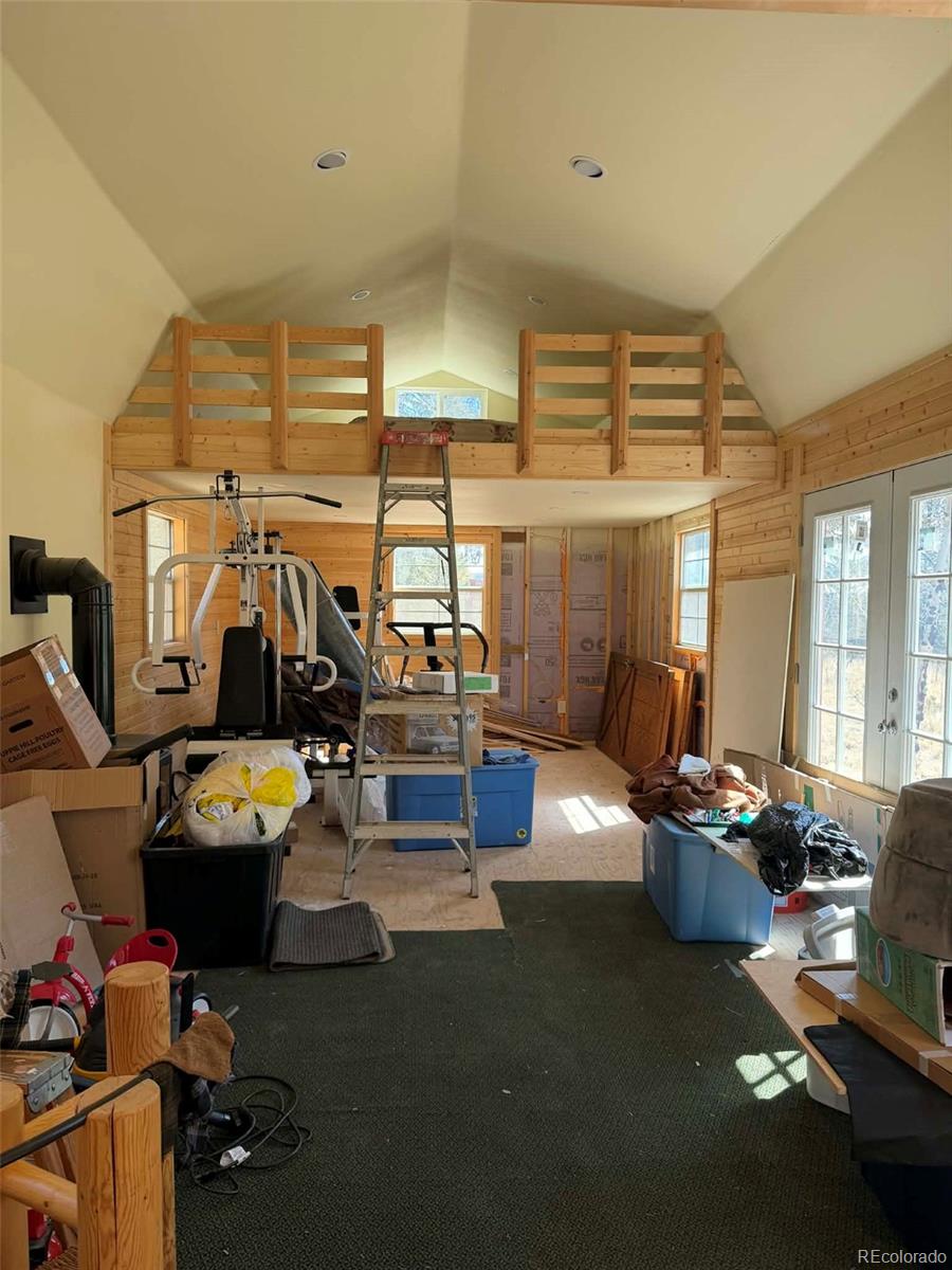 33623 Smith Road Pine, CO 80470 - Photo 22 of 45 a living room with furniture and gym equipment