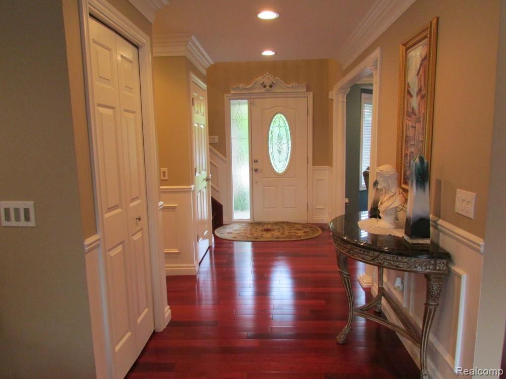 3052 St Clair Drive Rochester, MI 48309 - Photo 3 of 34 Front Foyer with Gleaming Brazilian Cherry Hardwoods and Gorgeous Trim