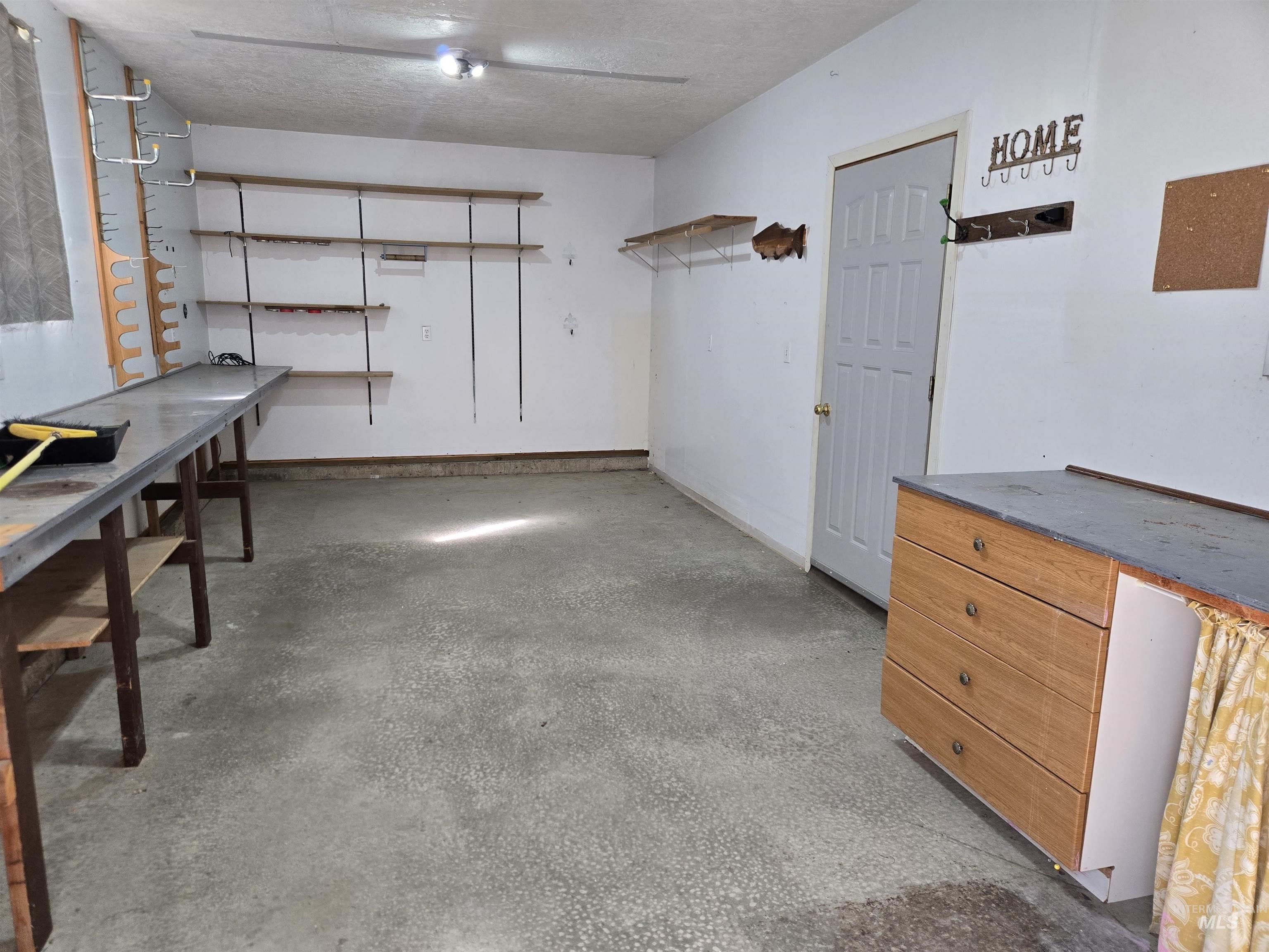 2794 9th Avenue Clarkston, WA 99403 - Photo 33 of 34 Interior space featuring unfinished concrete flooring and a textured ceiling