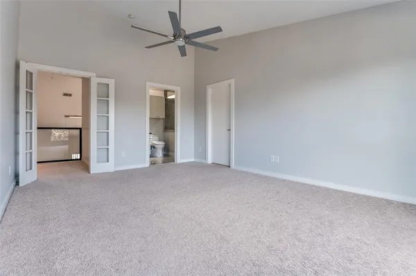 a view of a big room with closet and chandelier fan