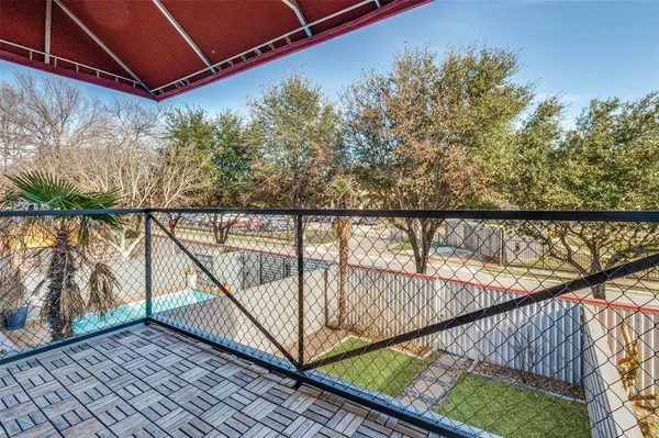 a view of balcony with small garden