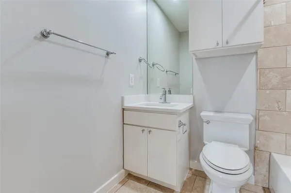 a bathroom with a sink toilet and vanity