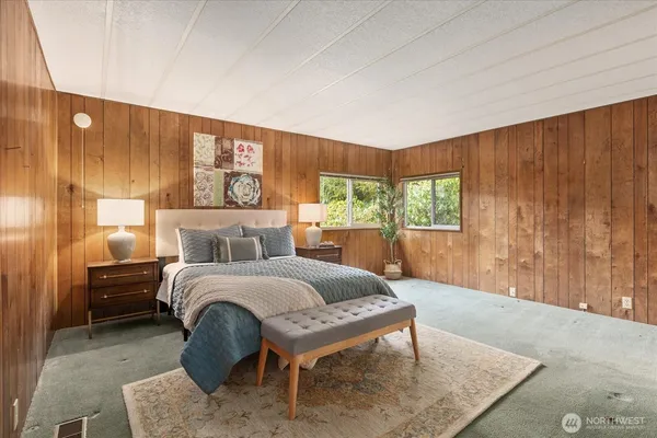 a bed room with a bed and a couch