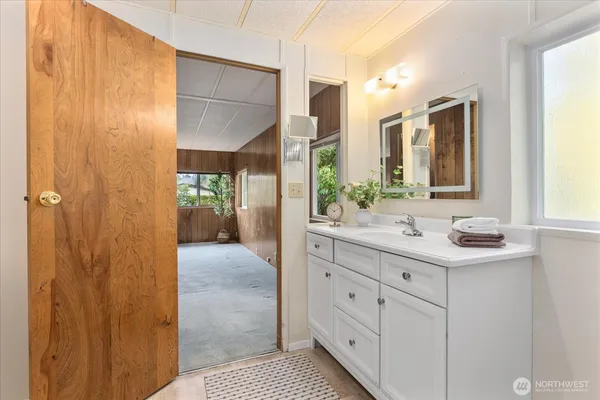 a bathroom with a sink and a mirror