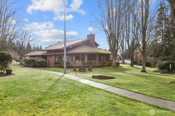 a view of a house with a yard
