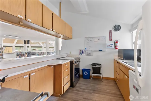 a kitchen with stainless steel appliances granite countertop a stove and a refrigerator