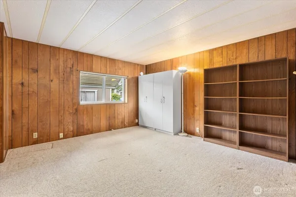 an empty room with a empty space and windows