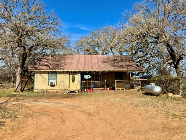 a view of a car park in front of house