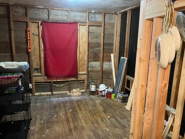 a bedroom with furniture and a closet