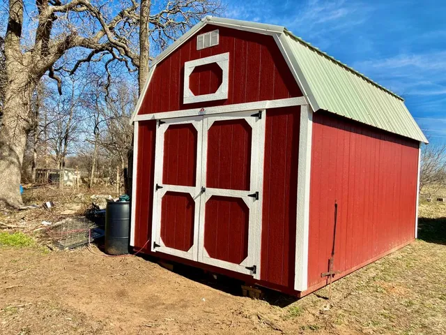 a view of a cars park in front of a house