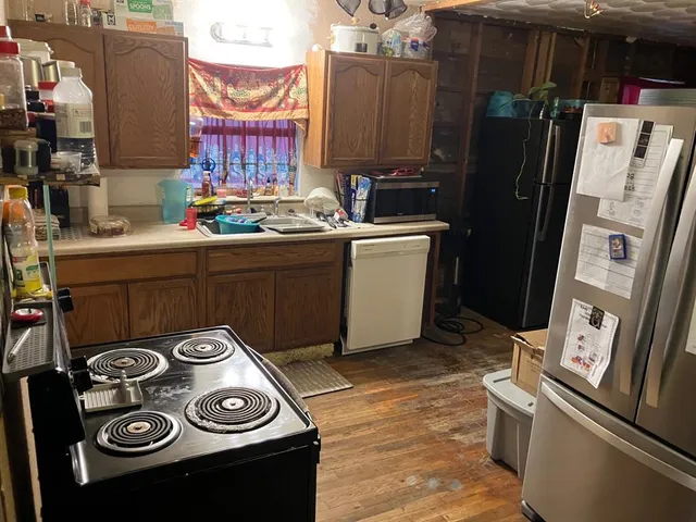 a kitchen with stainless steel appliances granite countertop a stove and a sink