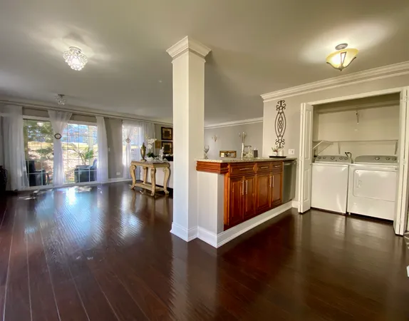an open kitchen with a sink and dish washer
