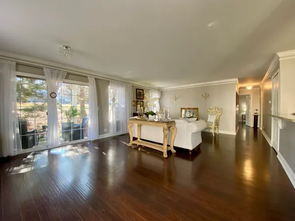 a bedroom with furniture and a large window