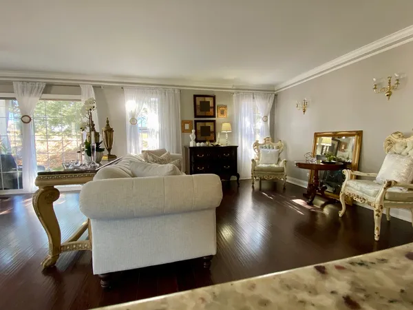 a living room with fireplace furniture and a flat screen tv