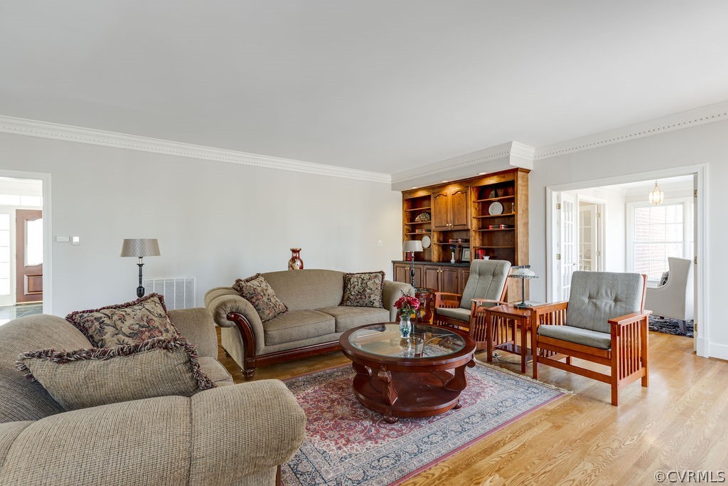11902 Reeds Bluff Lane Midlothian, VA 23113 - Photo 12 of 42 a living room with furniture and a large window