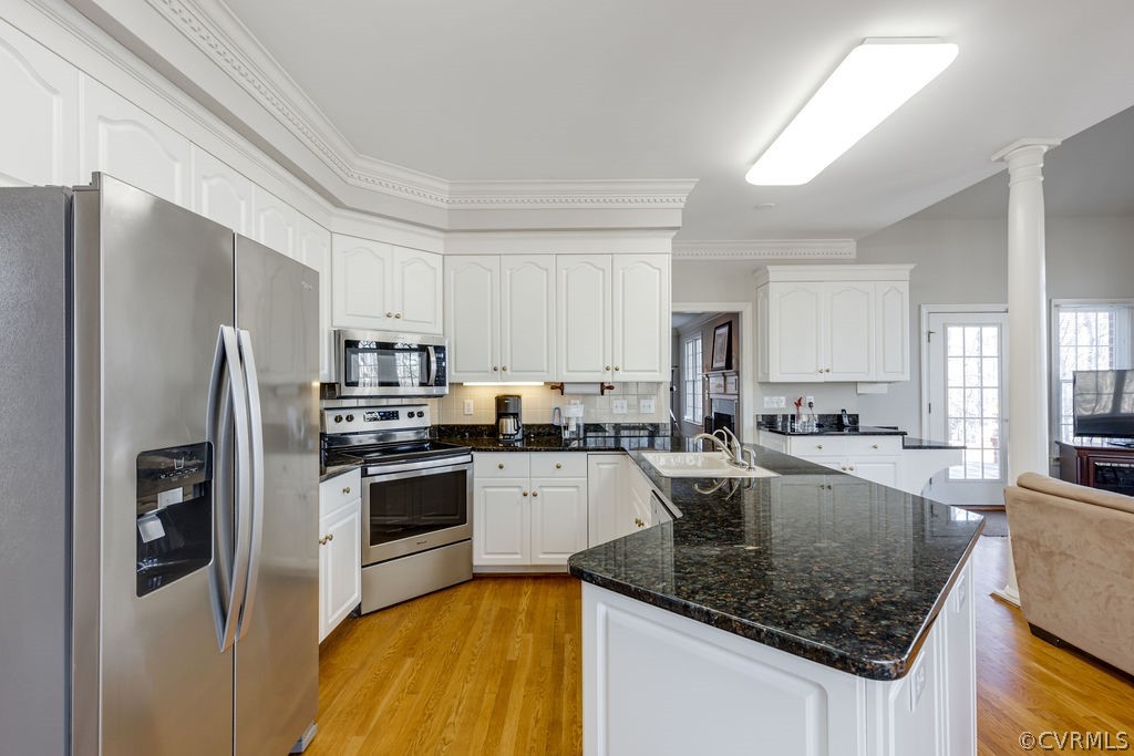 11902 Reeds Bluff Lane Midlothian, VA 23113 - Photo 14 of 42 a kitchen with stainless steel appliances granite countertop a refrigerator a stove and a sink