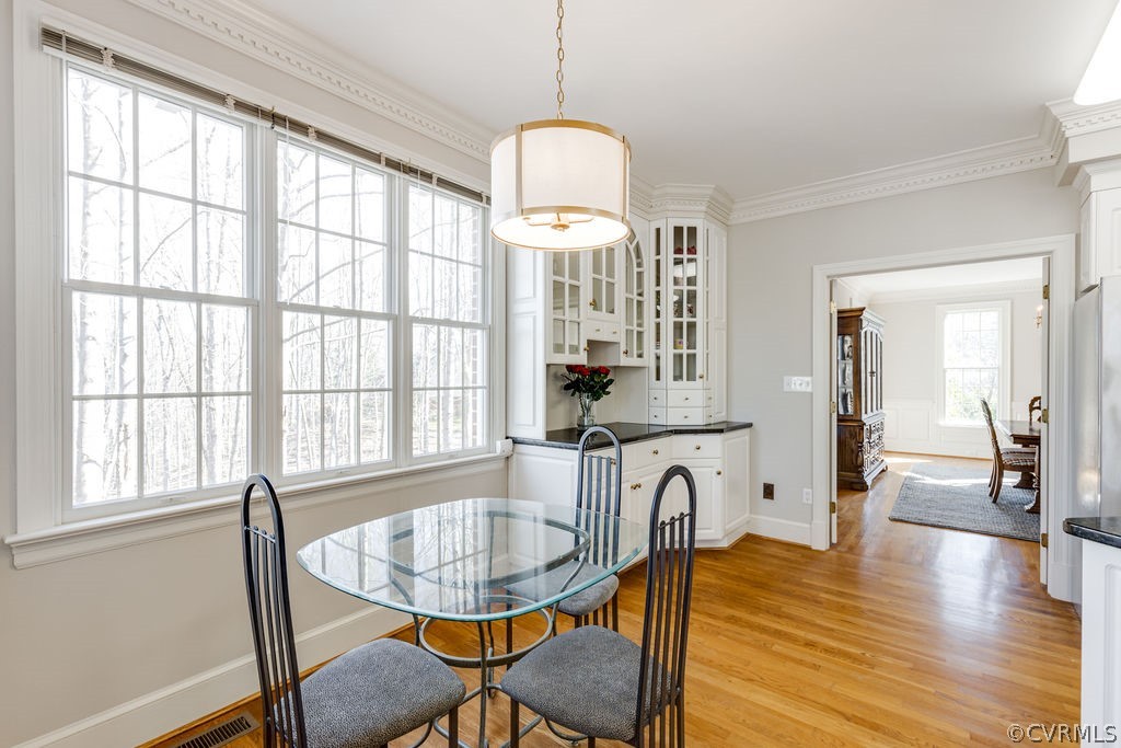 11902 Reeds Bluff Lane Midlothian, VA 23113 - Photo 16 of 42 a view of a dining room with furniture window and wooden floor