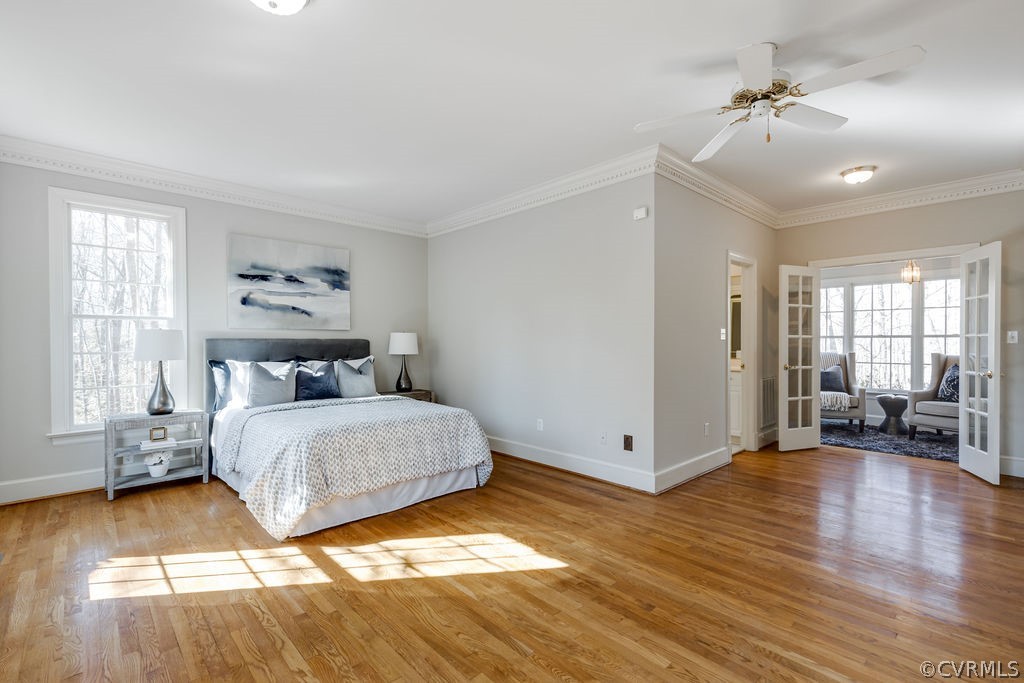 11902 Reeds Bluff Lane Midlothian, VA 23113 - Photo 19 of 42 a spacious bedroom with a bed and a chandelier