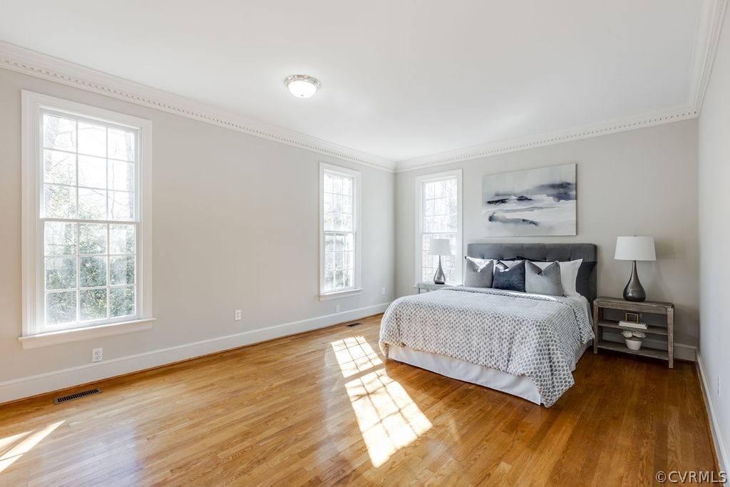 11902 Reeds Bluff Lane Midlothian, VA 23113 - Photo 20 of 42 a bedroom with a bed and wooden floor
